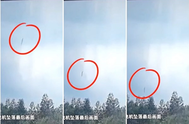 失事的中國東方航空被拍到以垂直角度墜向地面。   圖 : 翻攝自監視器畫面