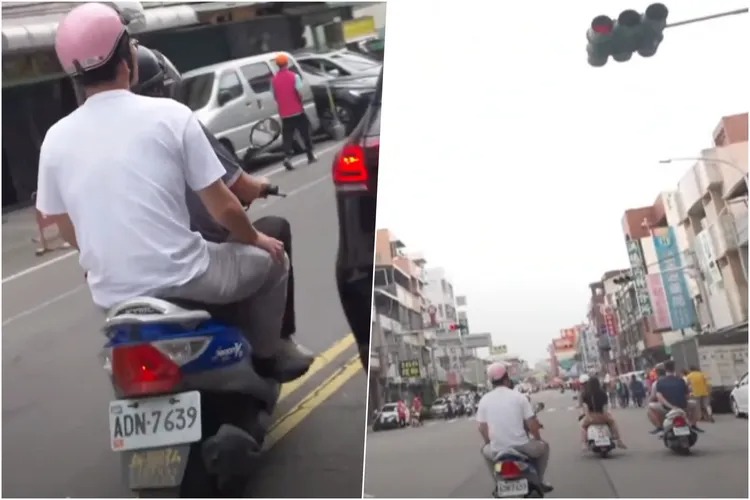 黃國昌乘坐的機車違規跨越雙黃線、逆向，還闖紅燈。   圖：翻攝自民眾黨YouTube直播